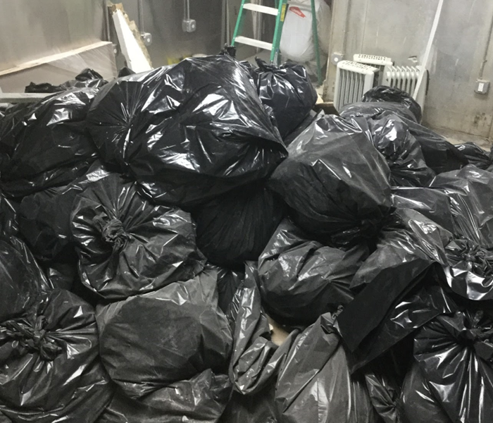 several black trash bags filled