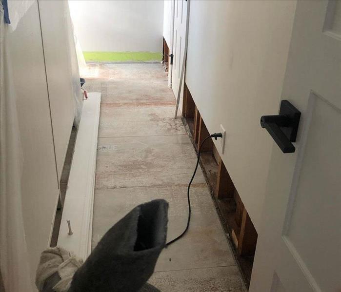 Flood cuts and flooring removed in hallway.